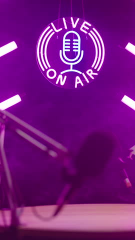 Live on Air podcast neon lights studio sliding over pink tubes