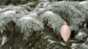 Decorative pine cone on a snow-covered pine branch — commercial video for festive advertising, product design, window displays, packaging, and marketing materials - Powered by Shutterstock - Get 15% off with code: PIKWIZARD15