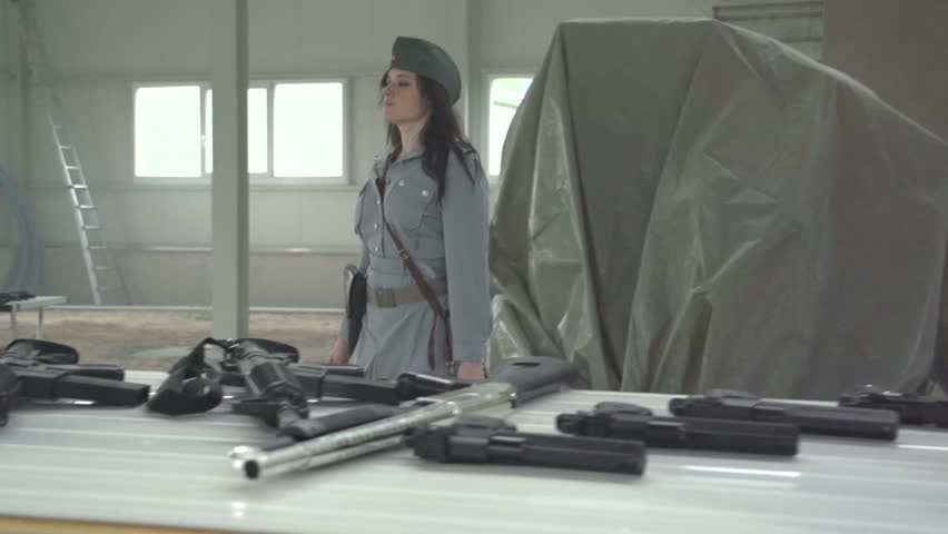 Female officer aiming with anti tank gun RPG7 in slow motion