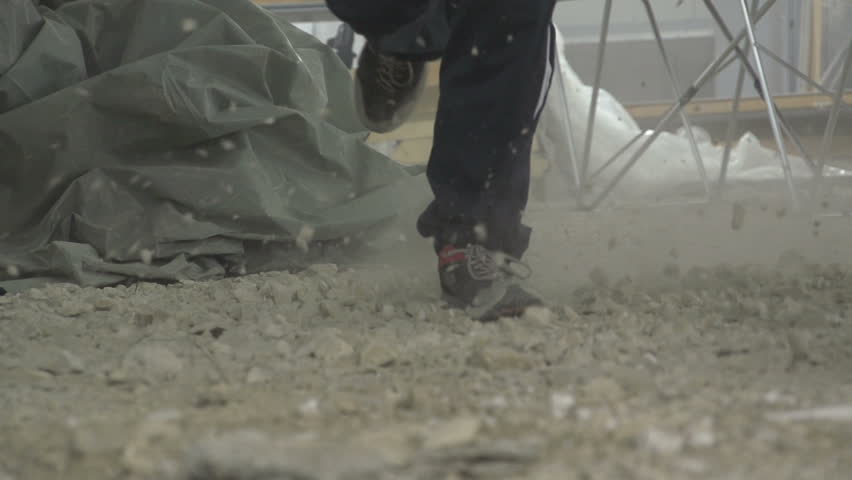 Person running in slow motion at construction site