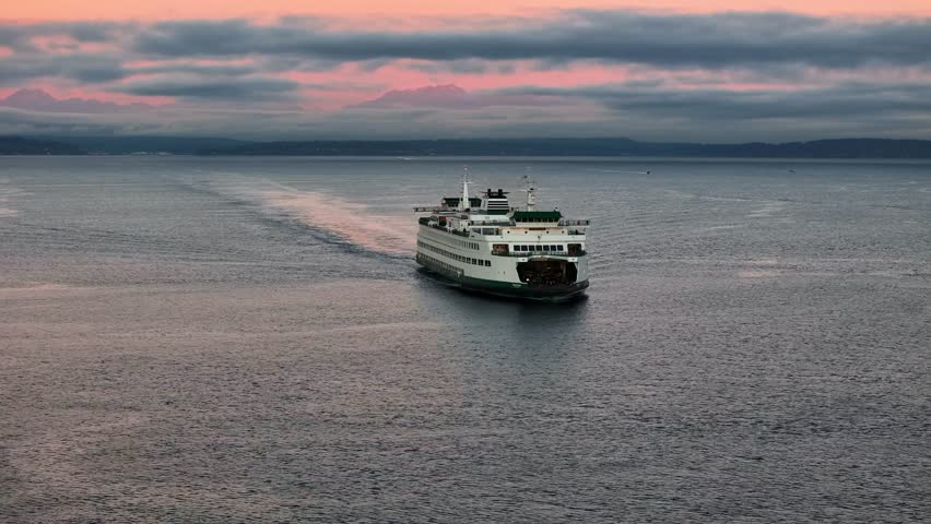 Descending over Bainbridge ferry as sunrise reflects on Puget Sound