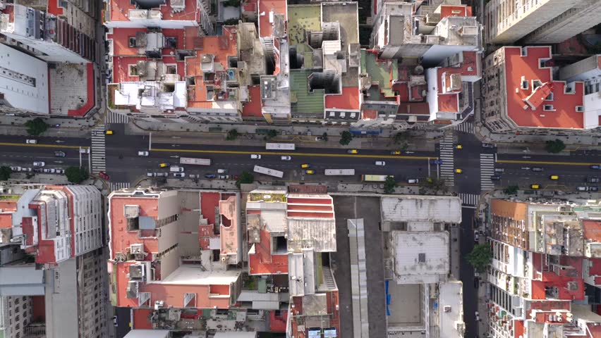 Vertical top down drone view of Buenos Aires city blocks showing streets, buildings, and urban traffic in Argentina.