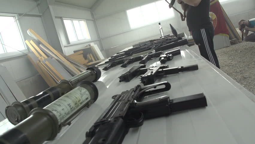 Russian weapon dealer checking AK 47