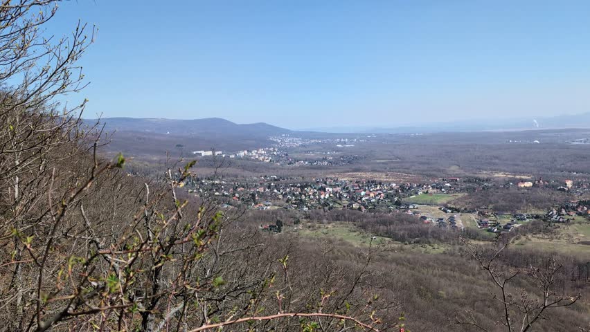 A vast, forested landscape with villages during fall - top view