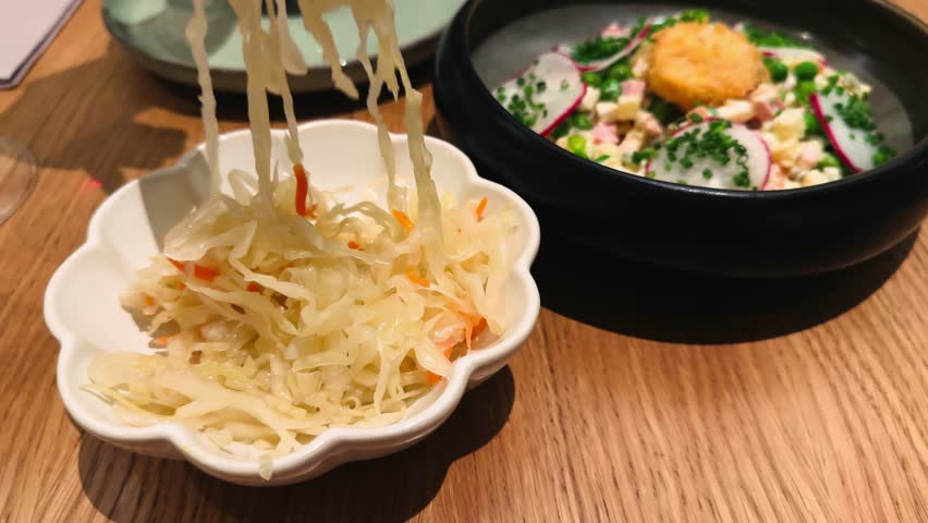 Fermented cabbage. Homemade sauerkraut with carrots and cranberries. High quality 4k footage