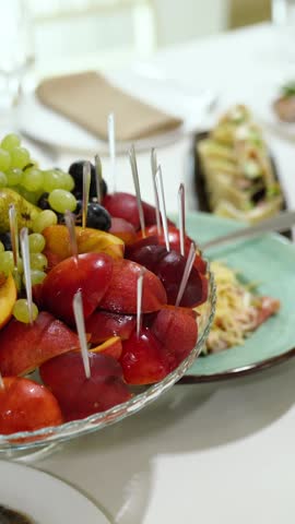 Fruit on the festive table at a banquet, a party with a buffet and food for guests. A birthday party with appetizers and dishes