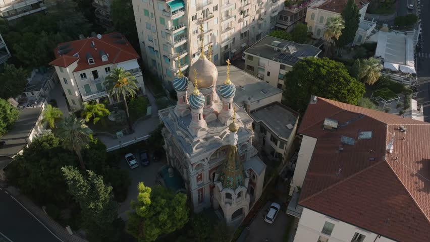 Beautiful exterior view of the Russian Orthodox Church in Sanremo, officially known as the Church of Christ the Savior. The video showcases the iconic colorful onion domes, ornate architecture, and historic details of this famous landmark in Sanremo, Italy. A calm and elegant atmosphere under natural daylight, ideal for travel, culture, religion, history, and tourism-related projects.