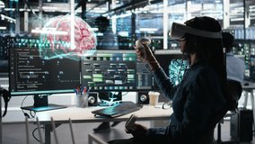 Software developer in data center uses virtual reality simulation to visualize machine learning systems, VFX compositing concept. Server room worker oversees neural network gear with VR headset gear - Powered by Shutterstock - Get 15% off with code: PIKWIZARD15