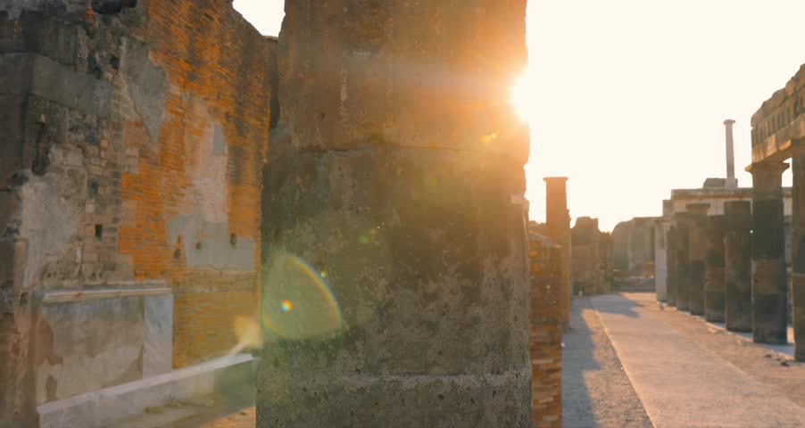 A detailed 4K view of the ruins of the Temple of Apollo in Pompeii, Italy, a major archaeological site preserved by the 79 AD eruption of Vesuvius.
