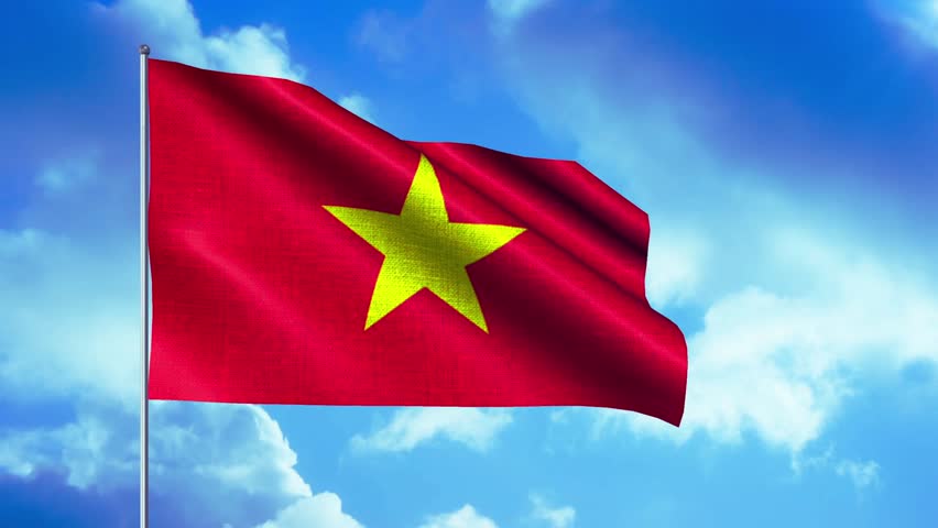 National flag of Vietnam waving against a dramatic cloudy sky, featuring the red field and yellow five-pointed star, symbolizing patriotism, sovereignty, and national identity.
