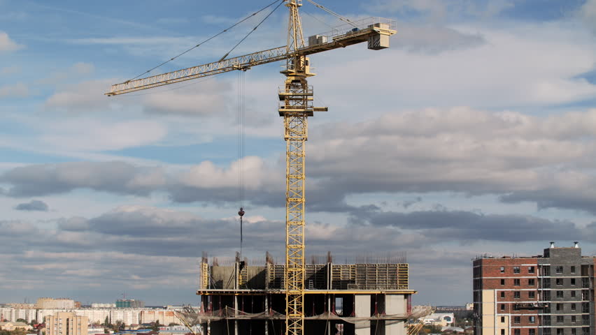 Timelapse tower crane working on construction site