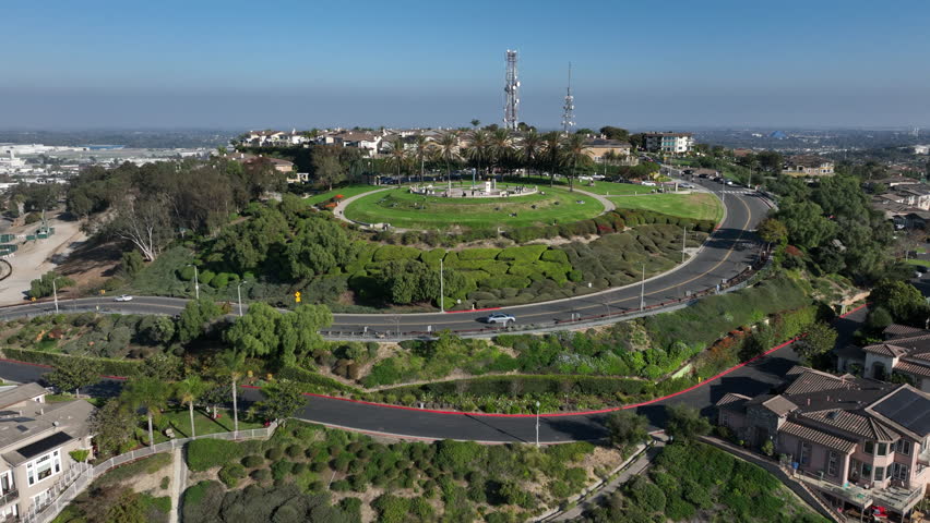 Signal Hill, Long Beach, California, USA - Aerial View of Hilltop Park With Bikers Riding in a Sunny Day and TV Antennas