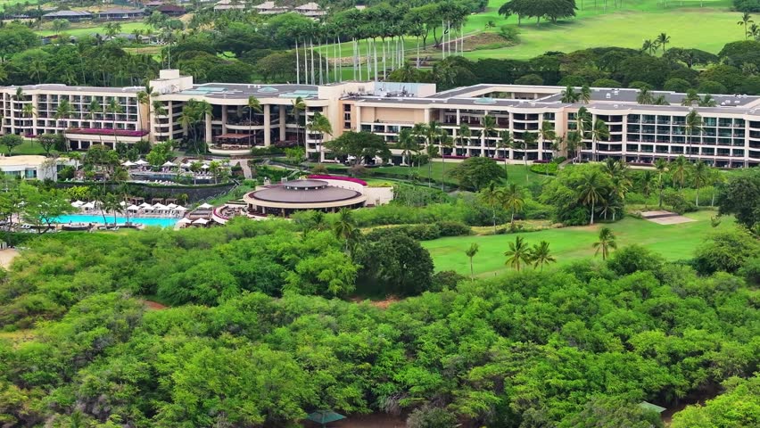 Aerial view of stunning lush nature landscapes and hotel resorts on the Big Island of Hawaii - 4K Drone