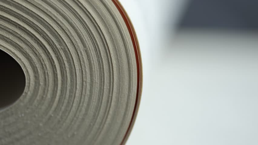 Close view of hands turning pages of a book