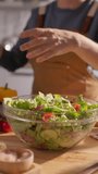 Fresh Organic Vegetable Salad Preparation Female Hands Ripping Green Lettuce Leaves Slow Motion Vertical Clip Healthy Vegan Lifestyle Clean Eating Concept - Powered by Shutterstock - Get 15% off with code: PIKWIZARD15