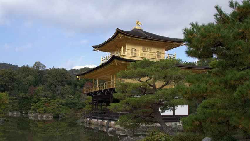 Sunlight sweeps across Golden Pavilion at Kinkakuji Temple in Kyoto
