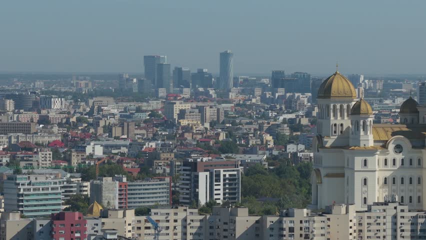 Bucharest, Romania, National Cathedral. Aerial 4K video with the biggest Orthodox cathedral in the world with Bucharest in background. People
