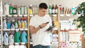 Young man buyer scanning qr code for shaving razor in household chemicals store - Powered by Shutterstock - Get 15% off with code: PIKWIZARD15