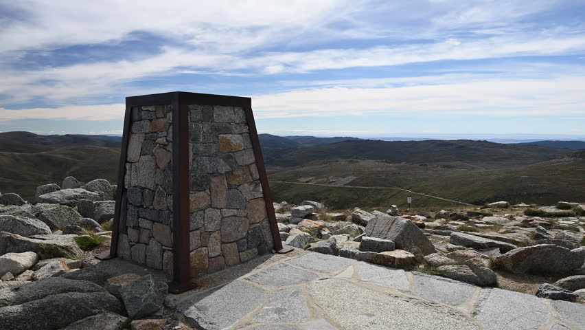 cairn marker at the top of Mount Kosciuszko the highest elevation in the Australian Alps and mainland Australia, part of the great dividing range and popular travel destination.