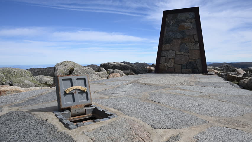 cairn marker at the top of Mount Kosciuszko the highest elevation in the Australian Alps and mainland Australia, part of the great dividing range and popular travel destination.