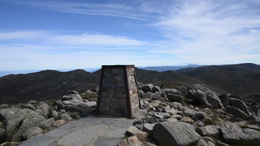 cairn marker at the top of Mount Kosciuszko the highest elevation in the Australian Alps and mainland Australia, part of the great dividing range and popular travel destination.