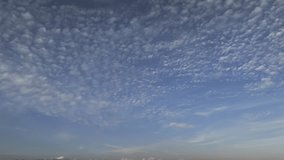 Altocumulus clouds appear as layered, rippling formations across the sky. These mid-altitude clouds add texture and depth, often signaling stable yet changing atmospheric conditions. - Powered by Shutterstock - Get 15% off with code: PIKWIZARD15