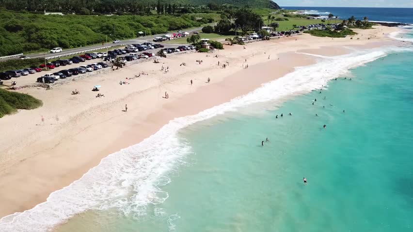 Hawaii Aerial Drone View of light blue water beach in Honolulu 4k