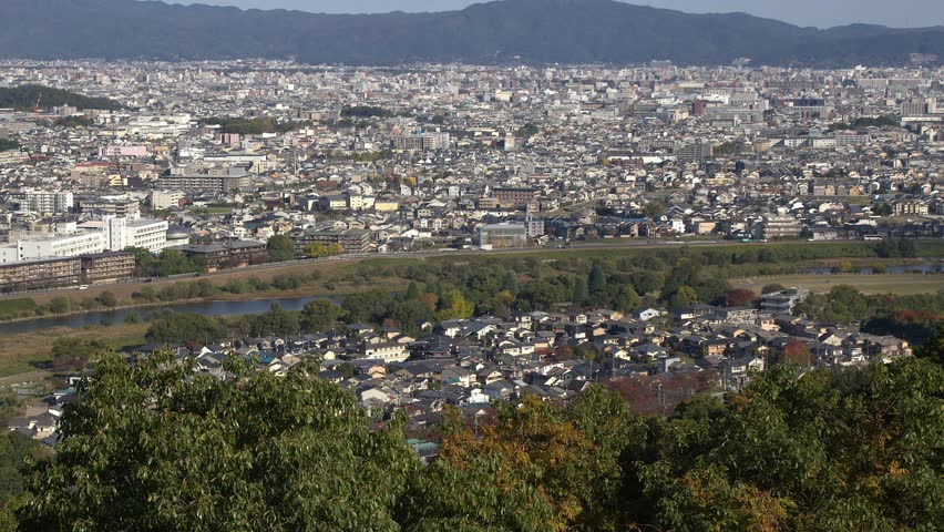 City traffic along Katsura River: Kyoto Japan cityscape overview