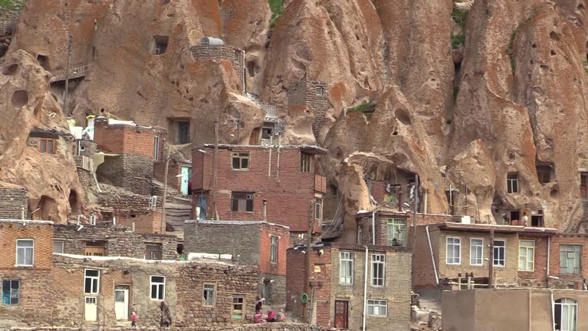 Panorama view of mountain village Kandovan, Iran, with houses and cave dwellings in summertime.