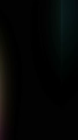 Subtle light leak overlay looped animation. A seamless loop of an abstract motion background featuring vertical, colorful glowing light beams against a black backdrop. For VJ loops, concert visuals, cyberpunk themes, creative title sequences.