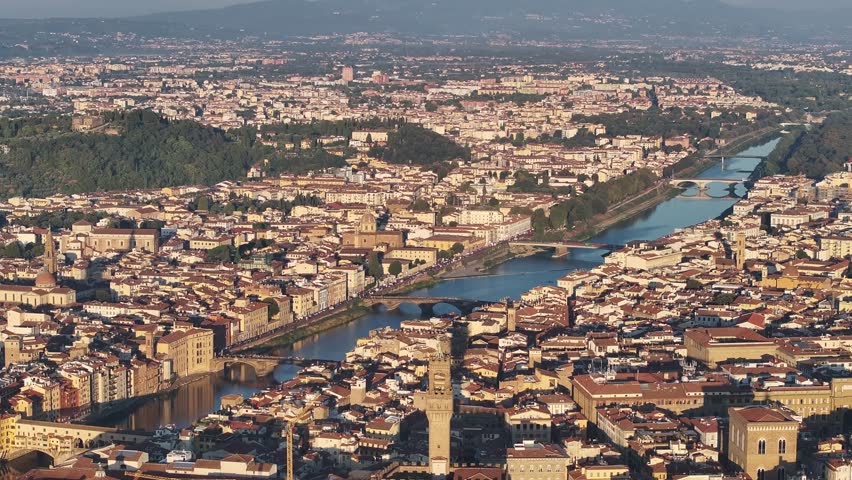 Dynamic high-angle drone view slowly panning across Florence
