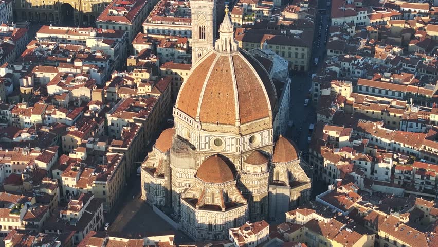Close-up vertical aerial drone view of the Florence Duomo, or Florence Cathedral, and Giotto