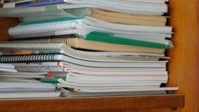 A stack of books and notebooks lie on a bookshelf. Study. - Powered by Shutterstock - Get 15% off with code: PIKWIZARD15