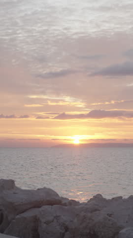 Colorful sunset seascape from rock pier