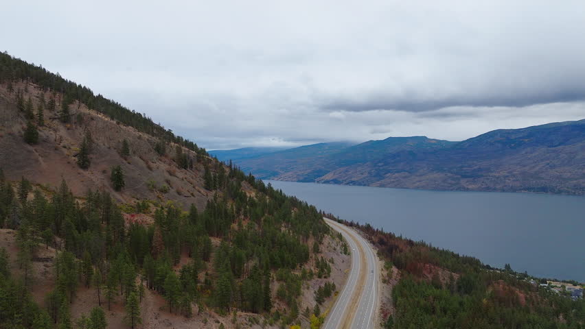 British Columbia scenery with mountains and Okanagan Lake on an overcast day