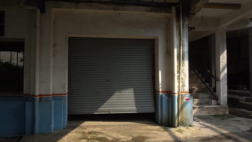Abandoned Old Building with Broken Windows and Decaying Walls