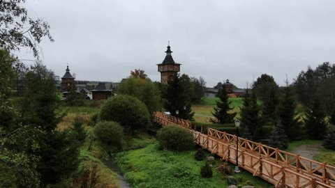 Forward Aerial Flight over Wooden Architecture