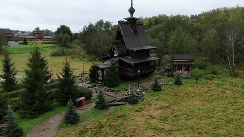 Drone Ascending toward Wooden Countryside Church