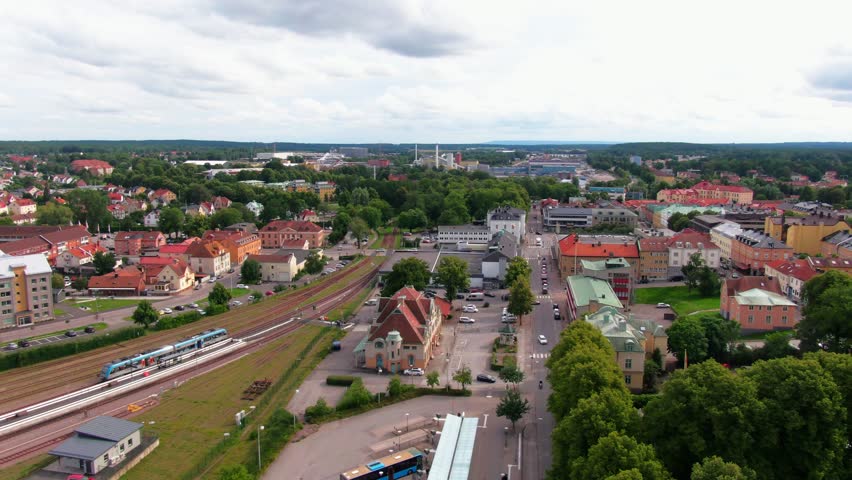 Aerial view of a regional train moving through Mariestad