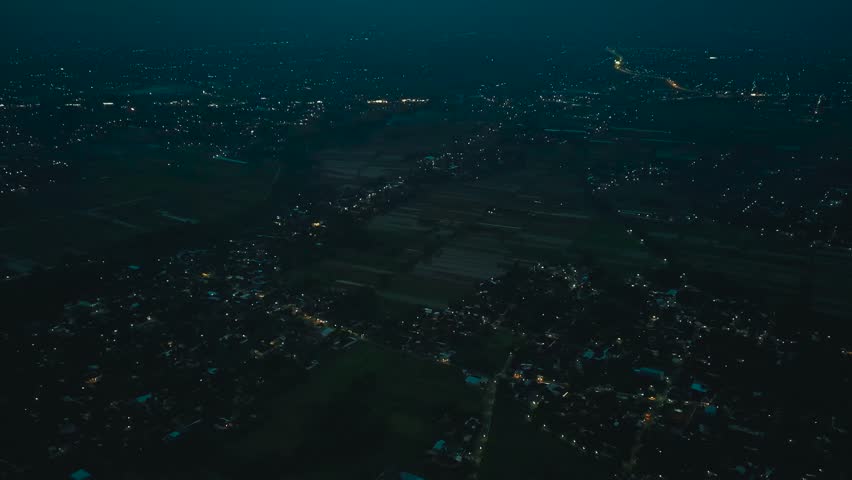 Night Aerial Drone Footage of Expansive City Lights and Urban Landscape After Sunset