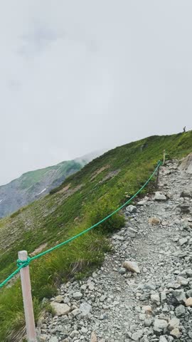Hiking trail to Happo Pond and the Japanese Alps mountain landscape on Hakuba Happo
