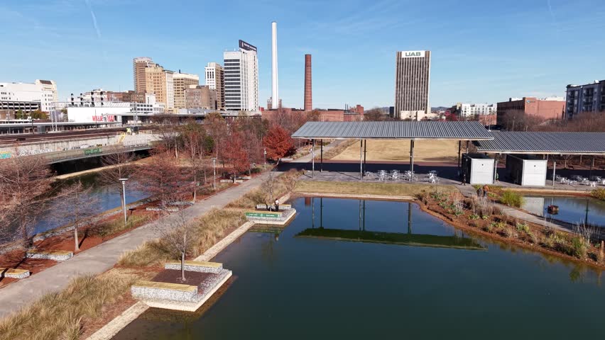Stunning 4K drone footage of Railroad Park in Birmingham, AL, showcasing green spaces and urban skyline. Ideal for city life, nature, or travel projects.