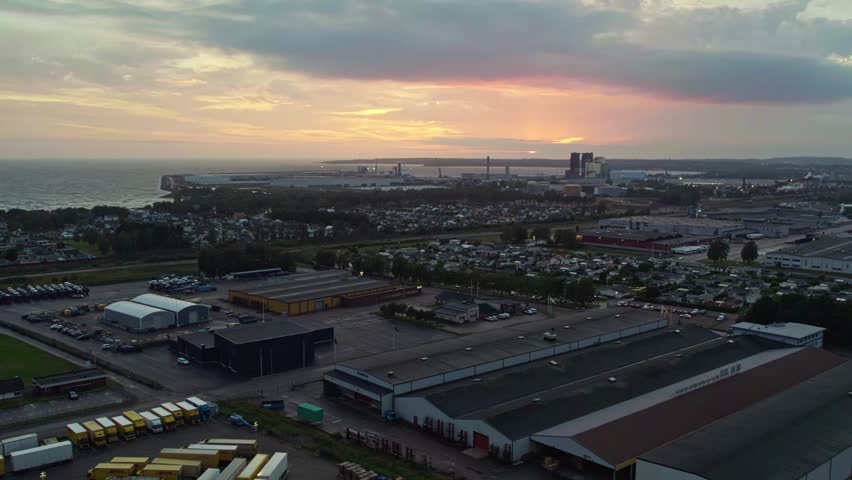 Sunset over Larsfrid industrial area in Halmstad, Sweden, serene evening sky
