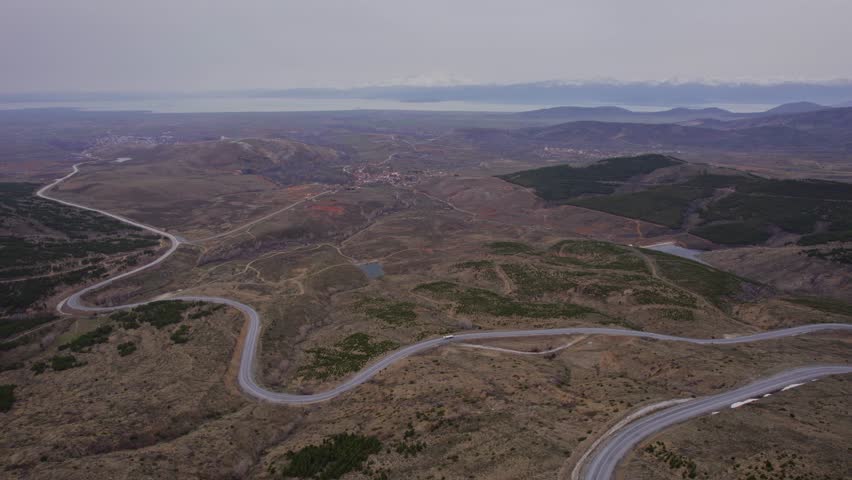 Aerial Drone Footage of Winding Asphalt Road Near Beysehir Lake