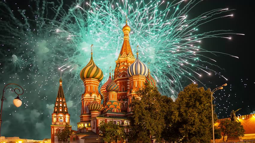 Temple of Basil the Blessed and fireworks in honor of Victory Day celebration (WWII), Red Square, Moscow, Russia. Time lapse, with zoom