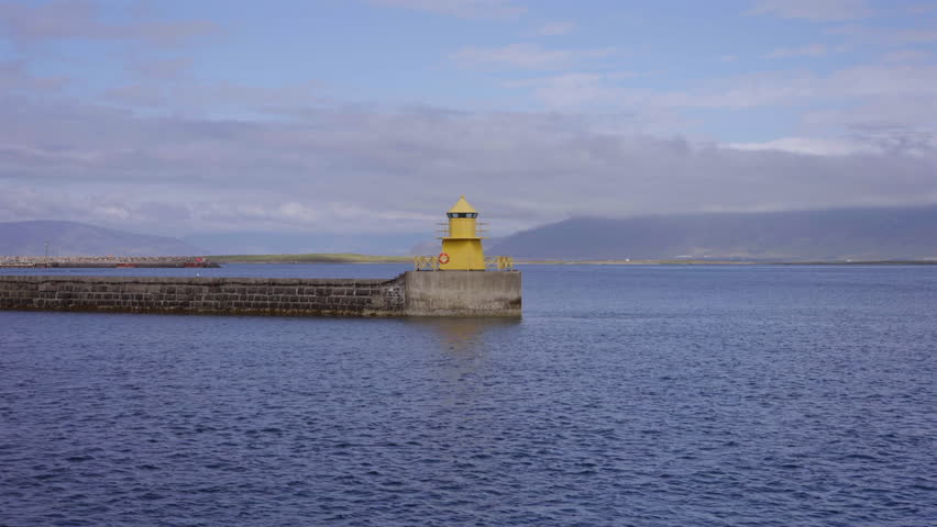Yellow Lighthouse on Sea Pier