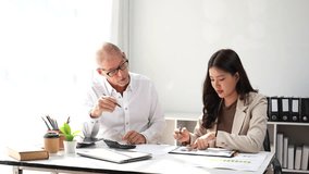 Diverse business team collaborating on a financial project, analyzing charts and using a calculator - Powered by Shutterstock - Get 15% off with code: PIKWIZARD15