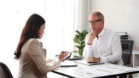 Two business colleagues analyzing financial data and planning company's budget in an office - Powered by Shutterstock - Get 15% off with code: PIKWIZARD15
