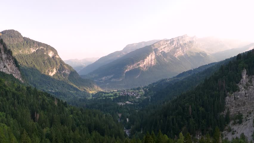 Drone flying high over a valley in the French Alps in 4k
