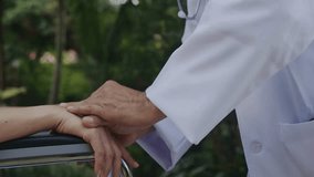 Doctor holds a patient's hands. Modern mental health, therapy or wellness help concept. A Doctor touching hands of senior patient for encouragement. - Powered by Shutterstock - Get 15% off with code: PIKWIZARD15